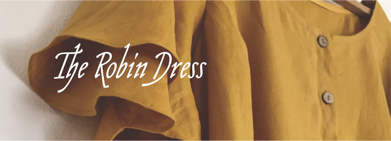 Banner reads 'The Robin Dress' over a detail of a yellow linen dress